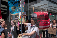 Protesters Rally At Tesla Dealership And March To Billionaires’ Offices In Manhattan