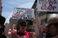 Protesters Rally At Tesla Dealership And March To Billionaires’ Offices In Manhattan