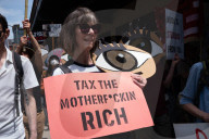 Protesters Rally At Tesla Dealership And March To Billionaires’ Offices In Manhattan