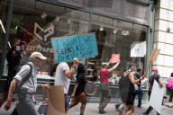 Protesters Rally At Tesla Dealership And March To Billionaires’ Offices In Manhattan