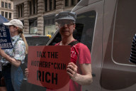 Protesters Rally At Tesla Dealership And March To Billionaires’ Offices In Manhattan