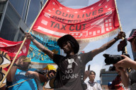 Protesters Rally At Tesla Dealership And March To Billionaires’ Offices In Manhattan