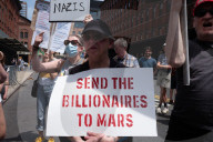 Protesters Rally At Tesla Dealership And March To Billionaires’ Offices In Manhattan