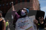 Protesters Rally At Tesla Dealership And March To Billionaires’ Offices In Manhattan