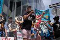 Protesters Rally At Tesla Dealership And March To Billionaires’ Offices In Manhattan