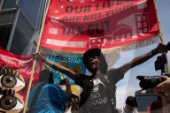 Protesters Rally At Tesla Dealership And March To Billionaires’ Offices In Manhattan