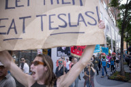 Protesters Rally At Tesla Dealership And March To Billionaires’ Offices In Manhattan