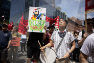 Protesters Rally At Tesla Dealership And March To Billionaires’ Offices In Manhattan