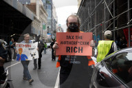 Protesters Rally At Tesla Dealership And March To Billionaires’ Offices In Manhattan