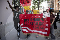 Protesters Rally At Tesla Dealership And March To Billionaires’ Offices In Manhattan