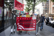 Protesters Rally At Tesla Dealership And March To Billionaires’ Offices In Manhattan