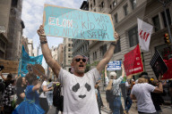 Protesters Rally At Tesla Dealership And March To Billionaires’ Offices In Manhattan