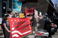 Protesters Rally At Tesla Dealership And March To Billionaires’ Offices In Manhattan