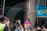 Protesters Rally At Tesla Dealership And March To Billionaires’ Offices In Manhattan