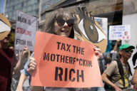 Protesters Rally At Tesla Dealership And March To Billionaires’ Offices In Manhattan