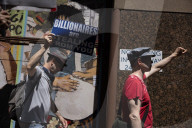 Protesters Rally At Tesla Dealership And March To Billionaires’ Offices In Manhattan