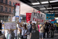 Protesters Rally At Tesla Dealership And March To Billionaires’ Offices In Manhattan