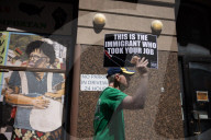 Protesters Rally At Tesla Dealership And March To Billionaires’ Offices In Manhattan