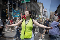 Protesters Rally At Tesla Dealership And March To Billionaires’ Offices In Manhattan