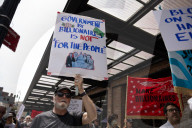 Protesters Rally At Tesla Dealership And March To Billionaires’ Offices In Manhattan