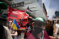 Protesters Rally At Tesla Dealership And March To Billionaires’ Offices In Manhattan