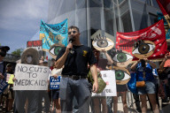Protesters Rally At Tesla Dealership And March To Billionaires’ Offices In Manhattan
