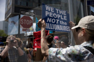 Protesters Rally At Tesla Dealership And March To Billionaires’ Offices In Manhattan