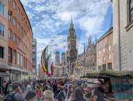 Tourists And Locals At Marienplatz In Front Of Munich’s New Town Hall