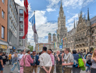 Tourists And Locals At Marienplatz In Front Of Munich’s New Town Hall