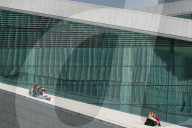 Visitors Relax On The Roof Of The Oslo Opera House