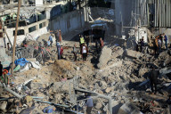 Israeli Strikes Kill 31 At Gaza Shelters For Displaced Palestinians