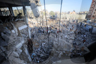 Israeli Strikes Kill 31 At Gaza Shelters For Displaced Palestinians