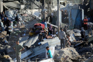 Israeli Strikes Kill 31 At Gaza Shelters For Displaced Palestinians