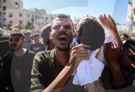 Palestinians Mourn Relatives Who Was Killed In An Israeli Airstrike In Gaza City