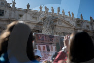 Faithful Wait At St Peter's Square As The Conclave To Elect A New Pope Starts In The Vatican