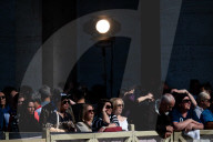 Faithful Wait At St Peter's Square As The Conclave To Elect A New Pope Starts In The Vatican