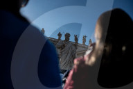 Faithful Wait At St Peter's Square As The Conclave To Elect A New Pope Starts In The Vatican