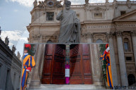  The Screen Displaying Footage Of The Start Of The Conclave At St Peter's Square In The Vatican 