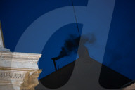  Black Smoke Emerges From The Chimney Atop The Sistine Chapel, Signaling That A New Pope Has Not Yet Been Elected By The Conclave At The Vatican On May 7, 2025. 