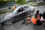 Activists Block Highway By Glueing Their Hands In Warsaw