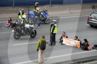 Activists Block Highway By Glueing Their Hands In Warsaw