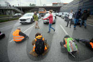 Activists Block Highway By Glueing Their Hands In Warsaw