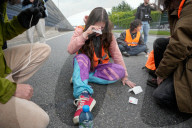 Activists Block Highway By Glueing Their Hands In Warsaw