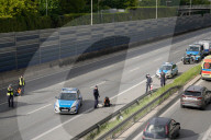 Activists Block Highway By Glueing Their Hands In Warsaw