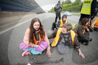 Activists Block Highway By Glueing Their Hands In Warsaw