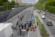 Activists Block Highway By Glueing Their Hands In Warsaw