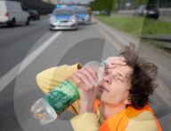 Activists Block Highway By Glueing Their Hands In Warsaw