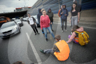 Activists Block Highway By Glueing Their Hands In Warsaw