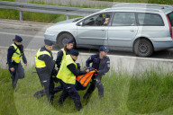 Activists Block Highway By Glueing Their Hands In Warsaw