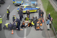 Activists Block Highway By Glueing Their Hands In Warsaw